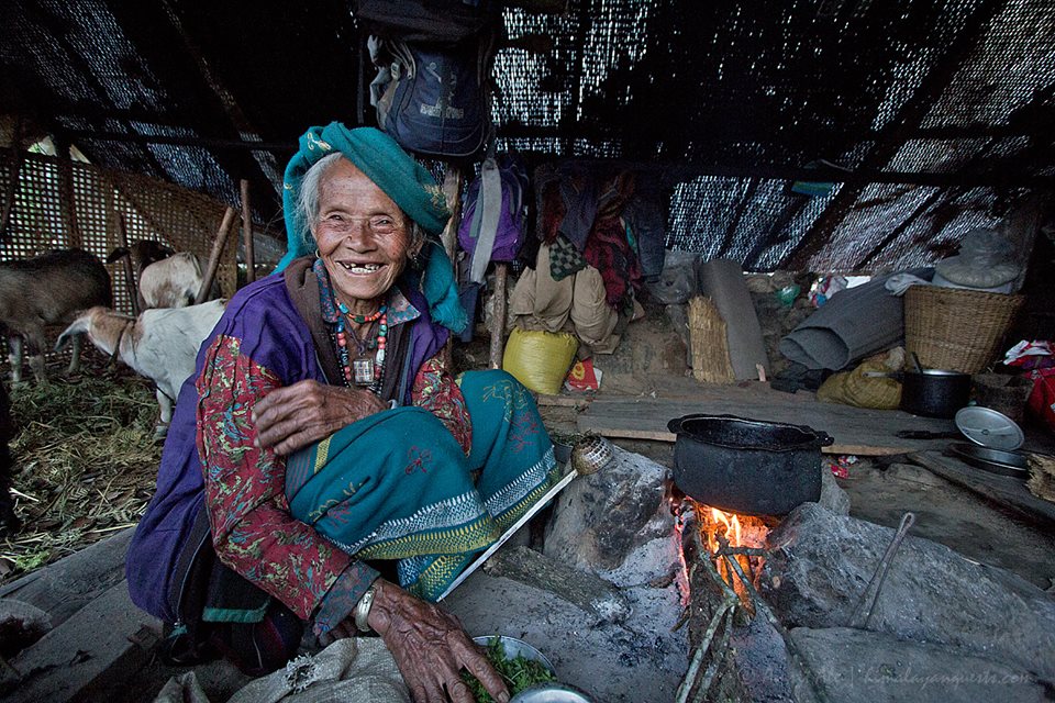 Nepal earthquake relief victim smiling in new shelter.